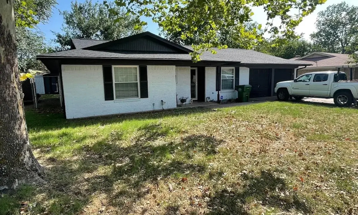Professional roofing crew working on a residential roof in New Richmond